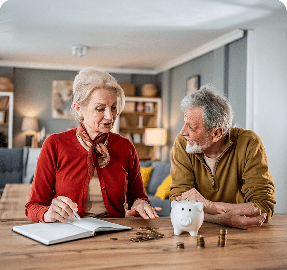 Elderly couple managing finances together