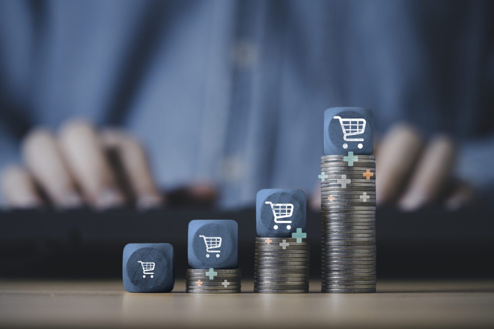 Shopping trolley cart stack on the top of increasing coins stacking for  online sale business growth concept.